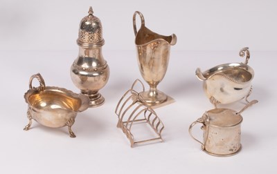 Lot 54 - A group of table silver comprising cream jug,...