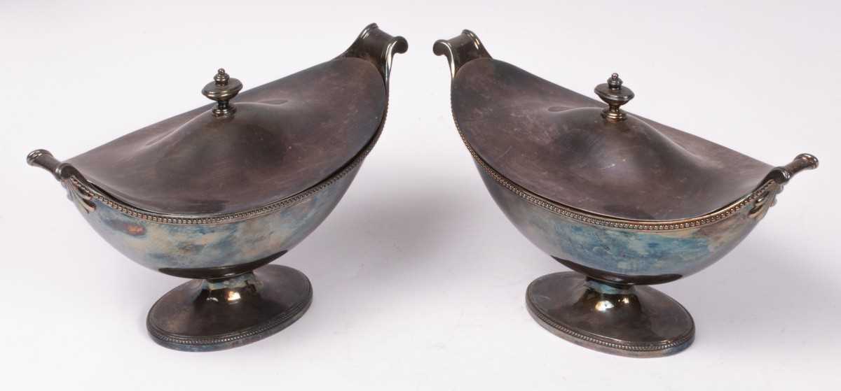 Lot 66 - A pair of George III silver sauce tureens and...