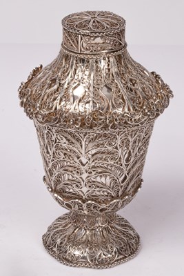 Lot 103 - An Eastern white metal scent bottle, the...