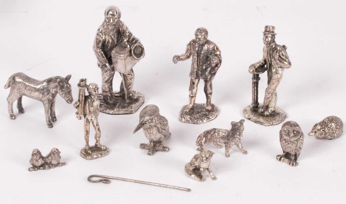 Lot 109 - A group of white metal figures, including...