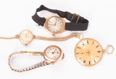 Lot 132 - An 18K open faced watch with an engraved dial,...