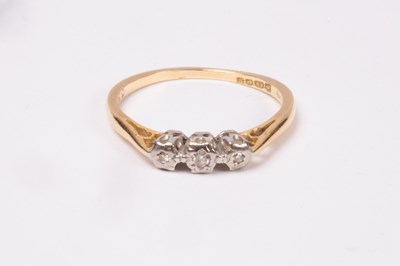 Lot 152 - A diamond three-stone ring, illusion set in...