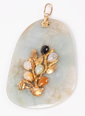 Lot 160 - A jade pendant, mounted 14K gold, floral...