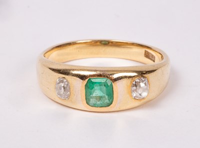 Lot 195 - An emerald and diamond dress ring set in 18ct...