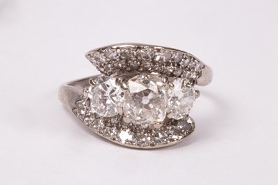 Lot 198 - A diamond crossover ring, centred by three...