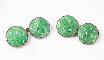 Lot 200 - A pair of carved jade cufflinks, the circular...