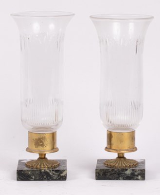 Lot 226 - A pair of glass and marble candleholders, the...