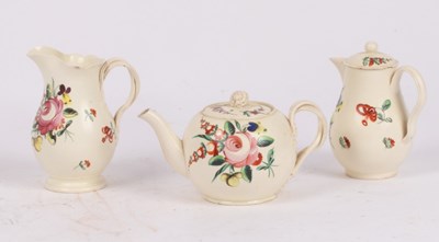 Lot 254 - An English creamware globular teapot and cover,...