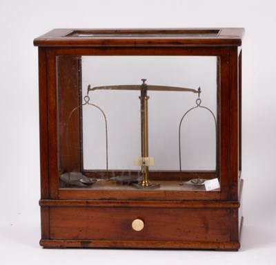 Lot 310 - A pharmacists scale by Oertling, London in a...