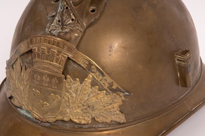 Lot 312 - A French fireman's brass helmet with crested...