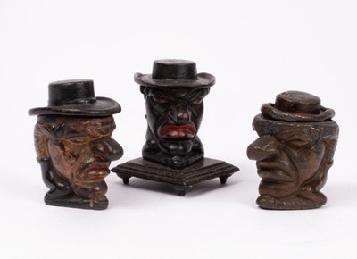 Lot 320 - Three Mr Punch tobacco jars, one lead, the...