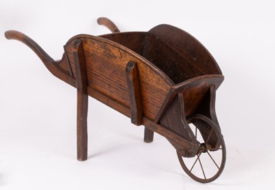 Lot 333 - A Victorian oak wheelbarrow with metal front...