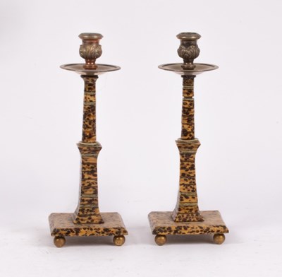 Lot 339 - A pair of faux tortoiseshell candlesticks,...