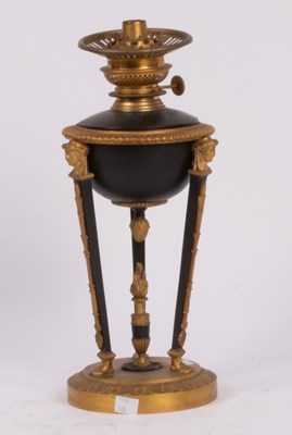 Lot 340 - An Empire style oil lamp, japanned and gilt...