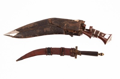 Lot 367 - A Kukri type knife, with wooden handle and...