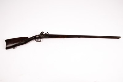 Lot 385 - A double-barrel flintlock muzzle loading...