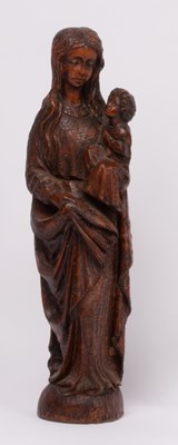 Lot 430 - A carved wooden figure of a mother and child,...