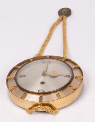 Lot 473 - A 1960s clockwork wall clock in a brass case...