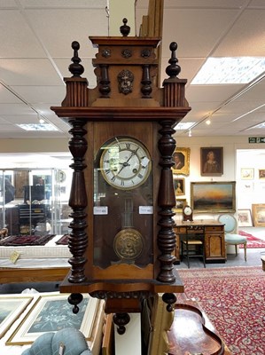 Lot 485 - A Vienna eight-day wall clock in a walnut case...