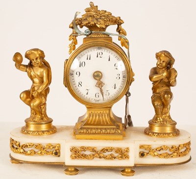 Lot 489 - A gilt metal mounted mantel clock, the white...