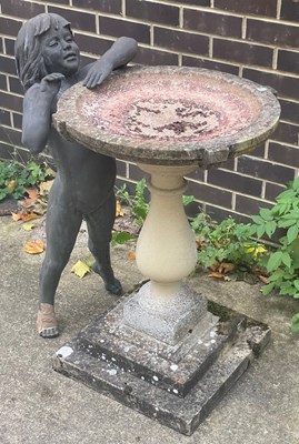 Lot 504 - A reconstituted stone bird bath on a pedestal...