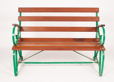 Lot 505 - A slatted garden seat with wrought iron green...