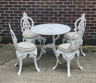 Lot 509 - A painted aluminium garden set of table and...