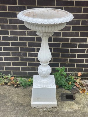 Lot 510 - A cast iron bird bath on a baluster column