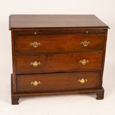 Lot 535 - An oak chest of three long drawers, 19th...