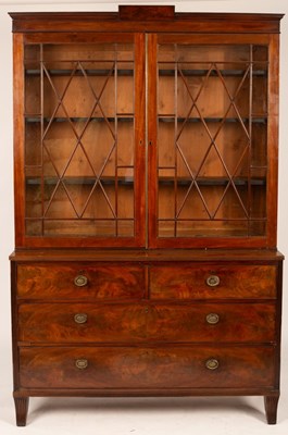 Lot 538 - A mahogany bookcase on chest, 19th Century,...