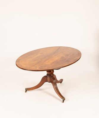 Lot 557 - A mahogany oval breakfast table of Regency...