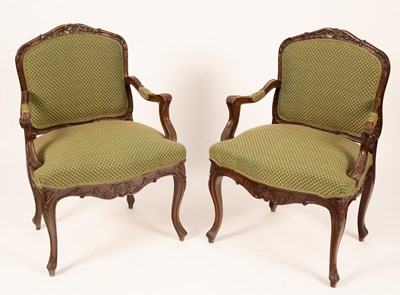 Lot 573 - A pair of carved walnut armchairs with...