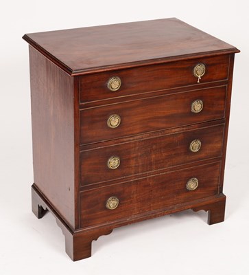 Lot 580 - A mahogany commode, with false four drawer...