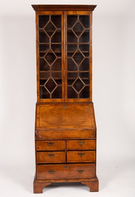 Lot 590 - A George II style walnut bureau bookcase,...