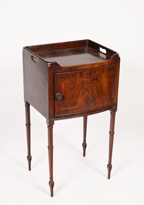 Lot 594 - A mahogany tray top bedside cupboard, on...