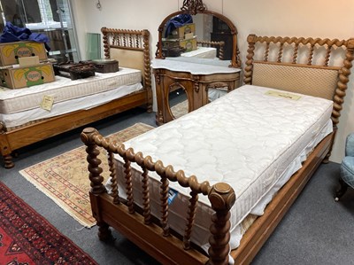 Lot 600 - A pair of carved beech framed single beds, the...