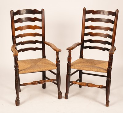 Lot 613 - A pair of ash framed ladder back chairs with...