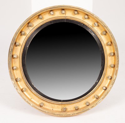 Lot 646 - A Regency gilt framed convex mirror with ball...