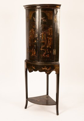 Lot 656 - A 19th Century black lacquered bowfront corner...