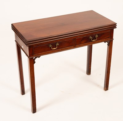 Lot 657 - A George III mahogany tea and card table, with...