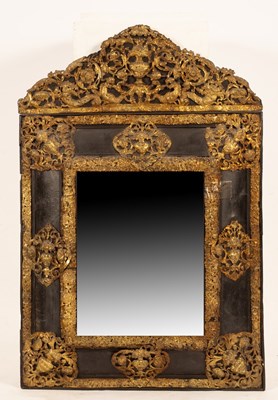 Lot 666 - A Flemish style wall mirror with embossed...