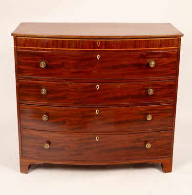 Lot 670 - A Regency mahogany bowfront secretaire chest,...