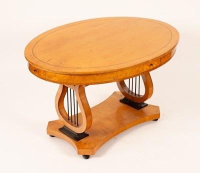 Lot 672 - A Biedermeier oval table, fitted a frieze...