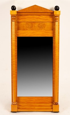 Lot 673 - A Biedermeier pier glass, the mirror plate...