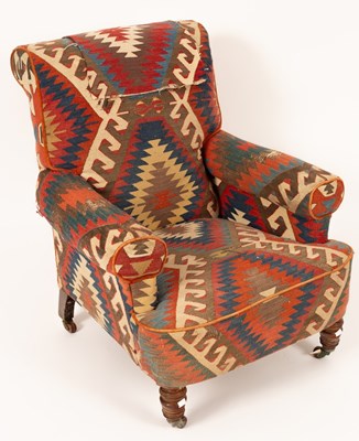 Lot 679 - A late Victorian kilim upholstered armchair on...