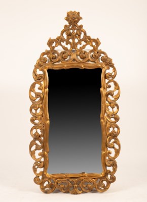 Lot 686 - A Rococo style gilt wall mirror, approximately...