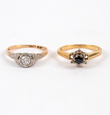 Lot 15 - A diamond solitaire ring in an illusion...