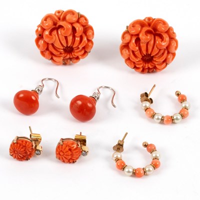 Lot 21 - A pair of coral ear clips, carved as...