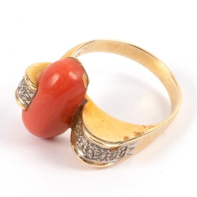 Lot 23 - A coral and diamond dress ring of modern...