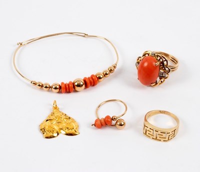 Lot 24 - A coral and diamond dress ring, the large oval...